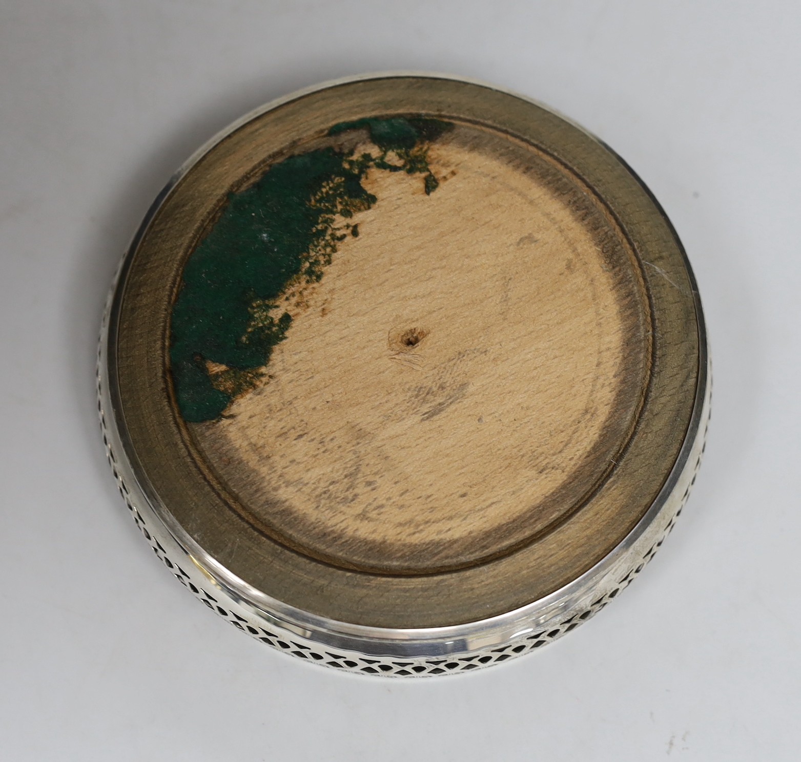 A modern pierced silver mounted wine coaster, A. Chick & Sons Ltd, London, 1970, diameter 13.3cm.